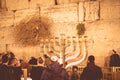 The eighth candle of Hanukkah. Prayer at the Western Wall of the Temple, Jerusalem, Israel