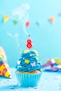 Eighth 8th birthday cupcake with candle blow out.Card mockup. Royalty Free Stock Photo