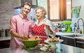 Grandmother baking cupcakes with her grandson Royalty Free Stock Photo