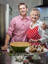 Grandmother in kitchen with her grandson Royalty Free Stock Photo