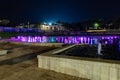 Enchanting grandiose musical performance - water and light show of a musical fountain on the embankment, in the center of the city