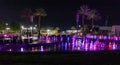 Enchanting grandiose musical performance - water and light show of a musical fountain on the embankment, in the center of the city