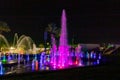 Enchanting grandiose musical performance - water and light show of a musical fountain on the embankment, in the center of the city