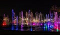 Enchanting grandiose musical performance - water and light show of a musical fountain on the embankment, in the center of the city