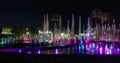 Enchanting grandiose musical performance - water and light show of a musical fountain on the embankment, in the center of the city