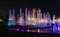 Enchanting grandiose musical performance - water and light show of a musical fountain on the embankment, in the center of the city