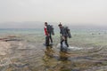 Eilat, Israel - May 2018: School of divers. Two divers go out of the sea Royalty Free Stock Photo