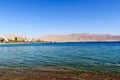 Eilat resort hotel panorama with beach and Aqaba with mountains at Red Sea, Israel Royalty Free Stock Photo