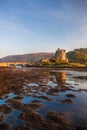 Eilean Donan Castle against sunset in Highlands of Scotland Royalty Free Stock Photo