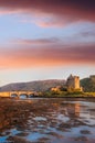 Eilean Donan Castle against sunset in Highlands of Scotland Royalty Free Stock Photo