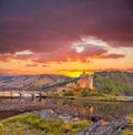 Eilean Donan Castle against sunset in Highlands of Scotland Royalty Free Stock Photo