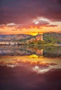 Eilean Donan Castle against sunset in Highlands of Scotland Royalty Free Stock Photo