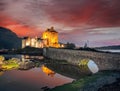 The Eilean Donan Castle with colorful sunset, Highlands of Scotland Royalty Free Stock Photo