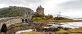 Panorama of Eilean Donan castle with Scottish flag Royalty Free Stock Photo