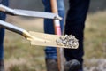 A golden spade at a groundbreaking ceremony for a building