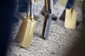 A golden spade at a groundbreaking ceremony for a building