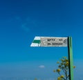 Weathered pointer to Mount Barqan against the blue sky. Israel