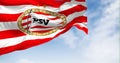 PSV Eindhoven football club waving in the wind on a clear day