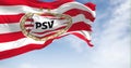 PSV Eindhoven football club waving in the wind on a clear day