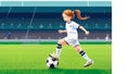 Eine junge Fussballspielerin in den Farben der deutschen Fussball Nationalmannschaft spielt mit ihren Fuessen einen Royalty Free Stock Photo