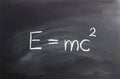 Einstein formula written on a chalkboard