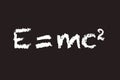 Einstein`s E = mc2 theory of special relativity written in chalk on a blackboard