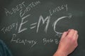 Einstein`s relativity formula and some related concepts written on a blackboard