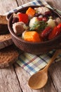 Eintopf with meat, sausages and vegetables close-up vertical Royalty Free Stock Photo