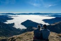 Eisenerzer Reichenstein - A happy couple sitting on a a meadow near Eisenerz in Styria, Austria. Wanderlust Royalty Free Stock Photo