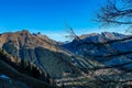 Eisenerzer Reichenstein - A tree branch with an alpine landscape near Eisenerz in Styria, Austria. Wanderlust