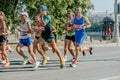 group male and female runners athletes run in Europe-Asia Marathon
