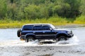 Jeep TOYOTA LAND CRUISER overcomes a ford in the river