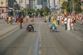 male wheelchair racers moving down street in Europe-Asia Marathon Royalty Free Stock Photo