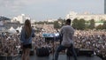 Ekaterinburg, Russia - August, 2019: View from the stage with singing on people fans. Action. Performance on stage on a