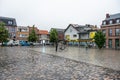 Ekeren, Antwerp province, Belgium - Old village square with wet cobble stones in the rain Royalty Free Stock Photo