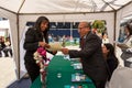 Old Man Gives a Certificate to a Young Aymara Indigenous Students in a Public Square