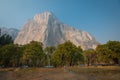 El Capitan seen from Yosemite valley floor. Cars and tourists on side of the road. Royalty Free Stock Photo