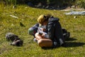 Adventure tourist rests at the Laguna Torre trail in the Los Glaciares National Park