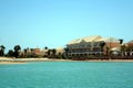 El Gouna, Egypt - July 09, 2017 - Nubian Style Villas Overlooking Tranquil Waters at El Gouna Resort in Egypt on a Sunny Day