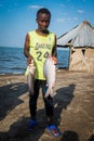 An El Molo fishermen with fish at El Molo village at the shores of Lake Turkana in Loiyangalani District, Kenya