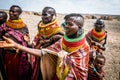 Women from the El Molo Tribe standing next to a dirt road in Loiyangalani, Turkana County, Kenya Royalty Free Stock Photo