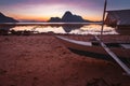 El Nido bay with local banca boat on shore on sunset at low tide. Picturesque nature scenery. Palawan, Philippines Royalty Free Stock Photo