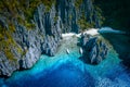 El Nido, Palawan, Philippines. Aerial above view of Secret hidden rocky lagoon beach with tourist banca boats in the