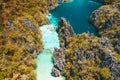 El Nido, Palawan, Philippines, aerial view of beautiful big lagoon, limestone cliffs and kayaking tourists