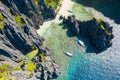 El Nido, Palawan, Philippines, aerial view of boats and cliffs rocky mountains scenery at Secret Lagoon beach