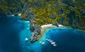 El Nido, Palawan, Philippines. Aerial view of Miniloc Island with diving boats above coral reef surrounded by karst