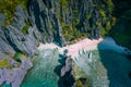 El Nido, Palawan, Philippines. Aerial view of Secret hidden lagoon beach with tourist banca boats on island hopping tour