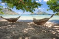 El Nido, Palawan, Philippines. Bamboo hammocks on shore in the shade. Beautiful tropical lagoon with epic Cadlao island Royalty Free Stock Photo