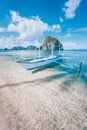 El Nido, Palawan, Philippines. Banca boat on sandy beach in shallow crystal clear water on island hopping trip. Amazing Royalty Free Stock Photo