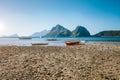El Nido, Palawan,Philippines. Local fishing boats during low tide at Las Cabanas Beach with amazing mountains in Royalty Free Stock Photo